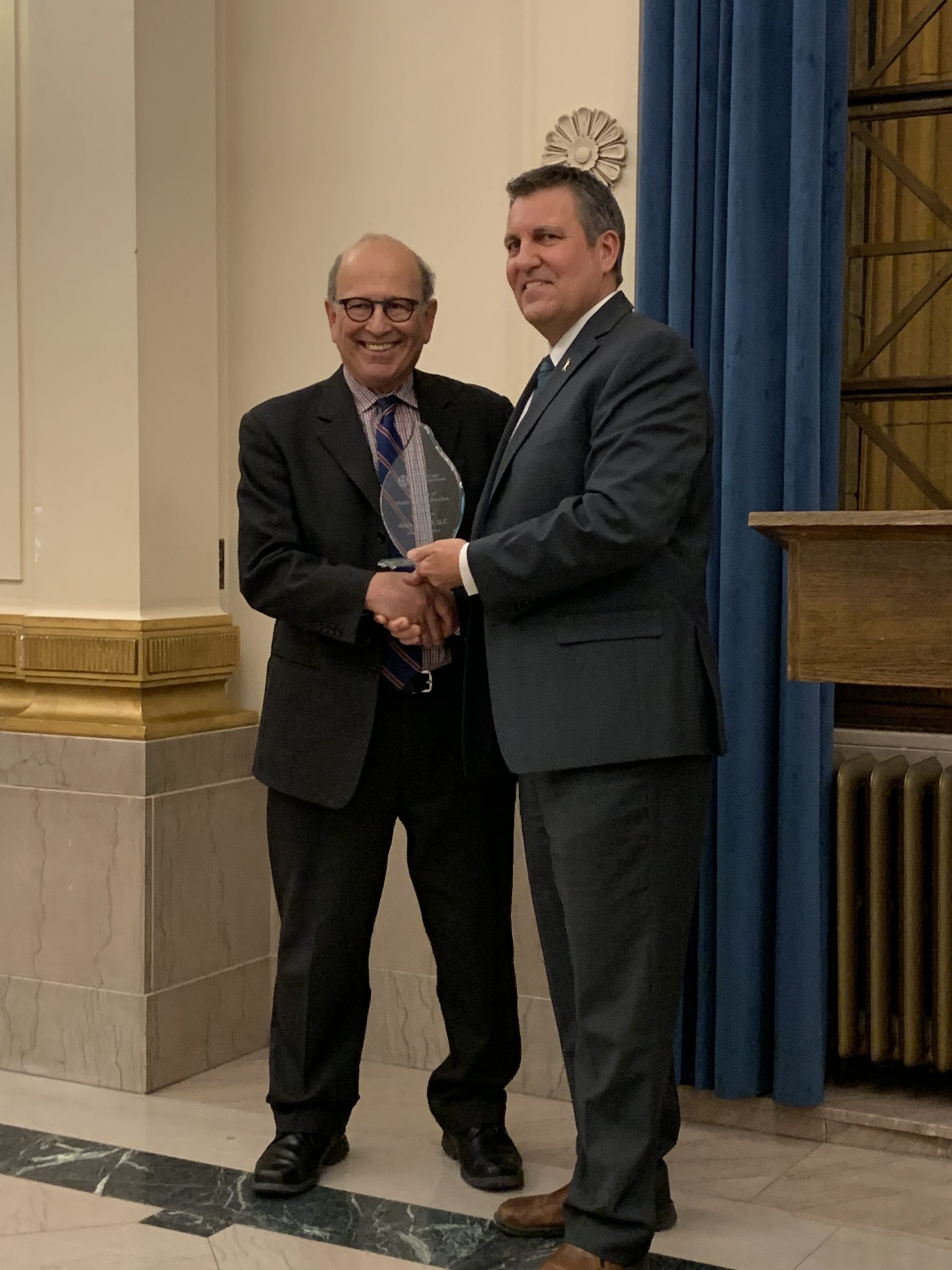 Minister of Justice, Hon. Cliff Cullen presenting Award to Allan Fineblit