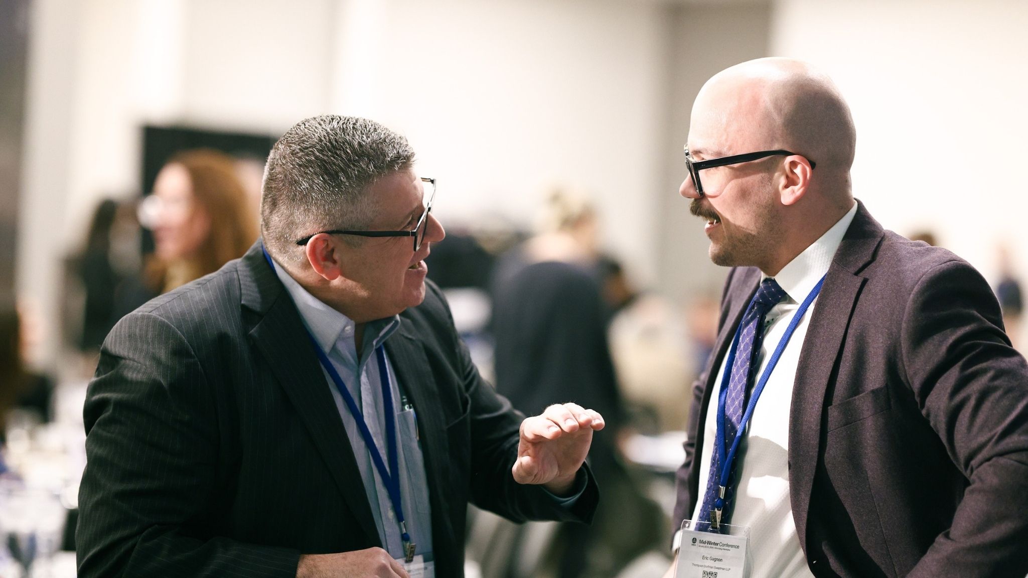 Eric Gagnon in conversation with colleagues at the awards event.
